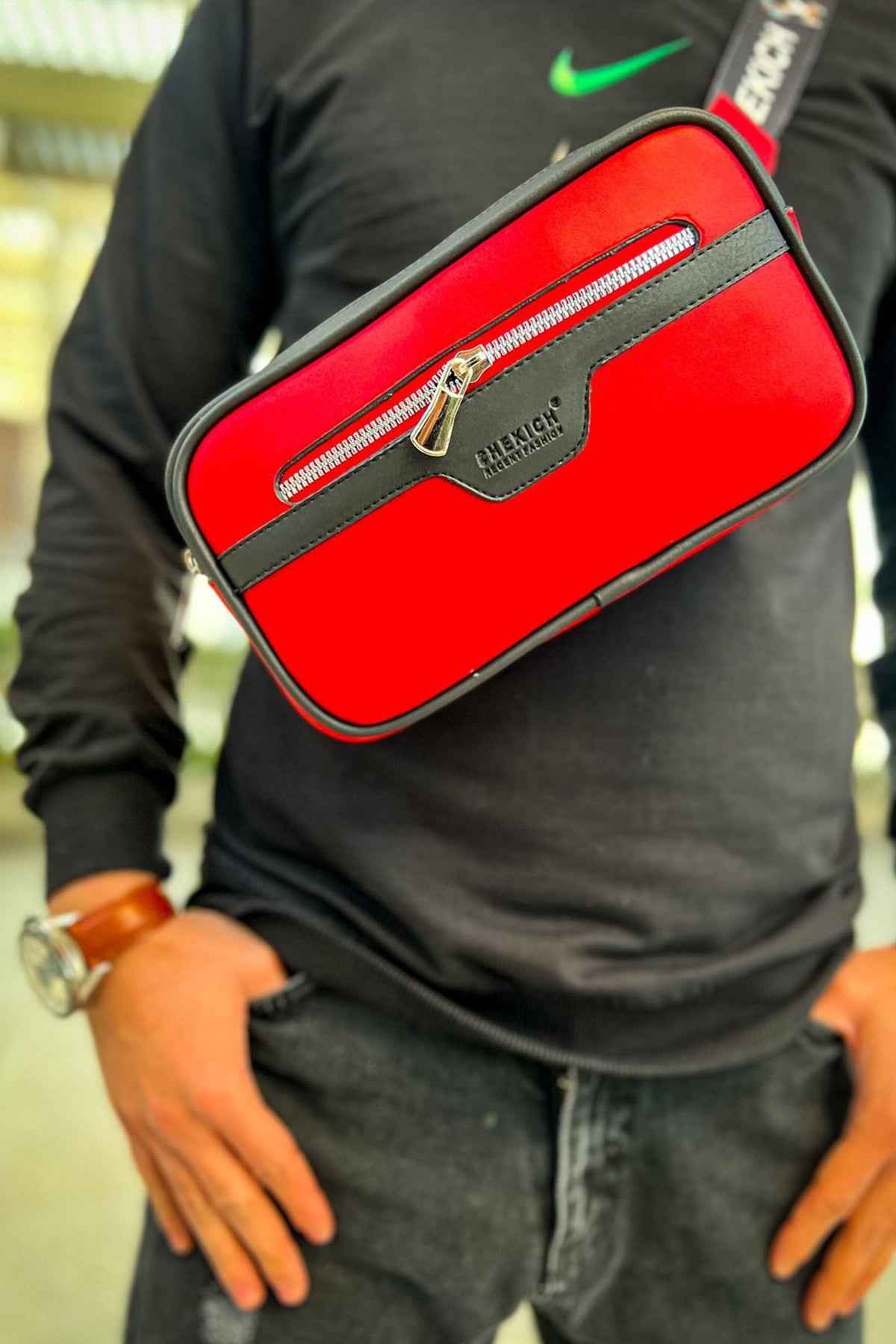 Red tablet bag with black edge trim and front zipper pocket