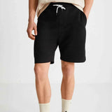 Black bermuda shorts, back view, drawstring waist and straight hem