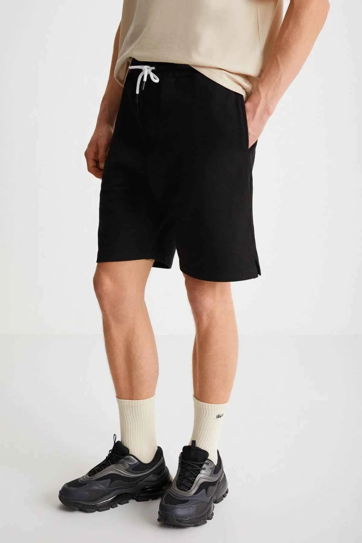 Black bermuda shorts detail, drawstring waist and front pockets