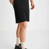 Black bermuda shorts with drawstring waist and above-knee hem