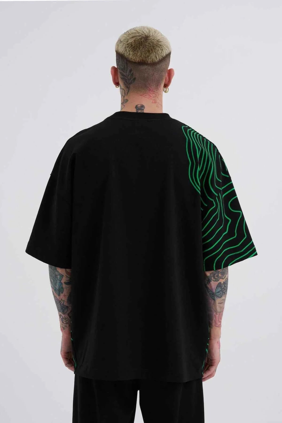 Men's oversized black T-shirt with green striped graphic on back