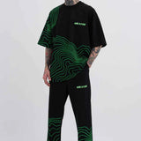 Men's oversized black T-shirt with green striped graphic and Macstar chest logo