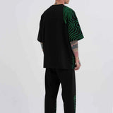 Men's oversized black T-shirt with green striped graphic on back