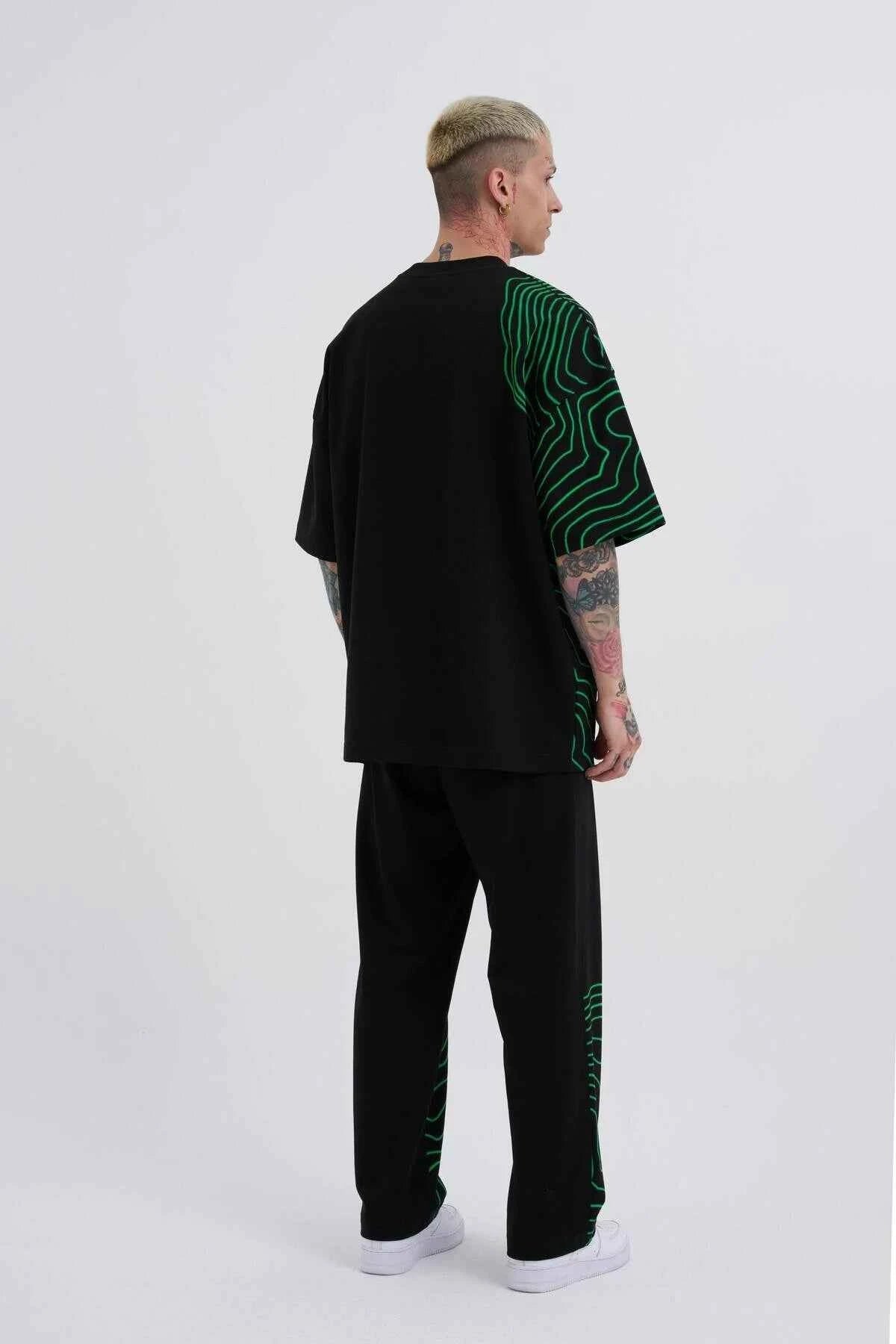 Men's oversized black T-shirt with green striped graphic on back
