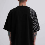 Men's oversize black T-shirt, back view, with white stripe graphics and small green Macstrar logo