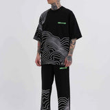 Men's oversize black T-shirt with white stripe panel graphic and green Macstrar logos