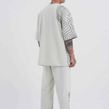 Men's oversize white T-shirt back view with black contour stripes