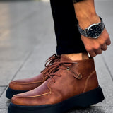 Men's tan lace-up casual boots with stitched panels and dark rubber sole