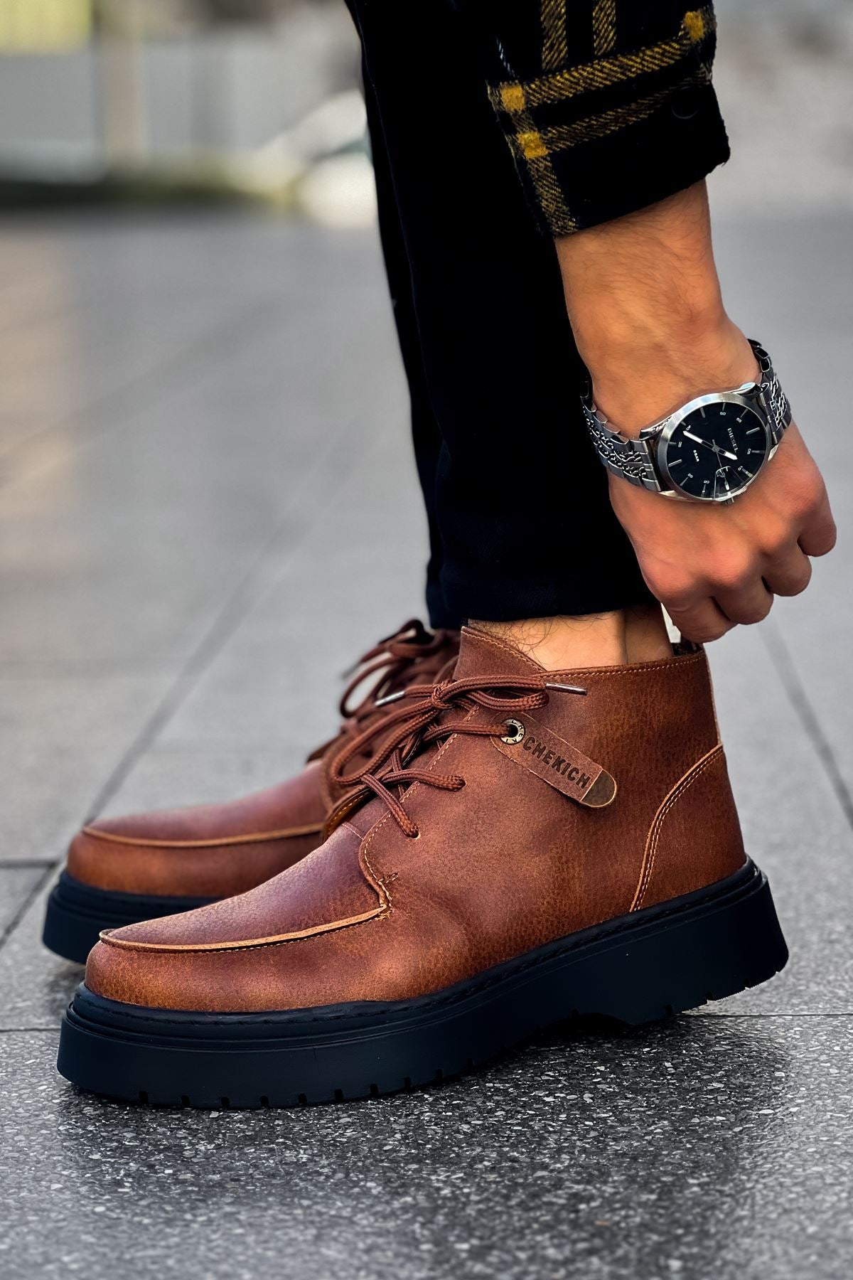 Men's tan lace-up casual boots with stitched panels and dark rubber sole