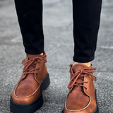 Men's tan lace-up casual boots with rounded toe and dark rubber sole