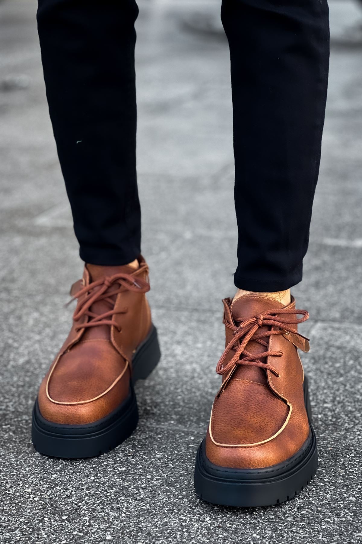 Men's tan lace-up casual boots with rounded toe and dark rubber sole