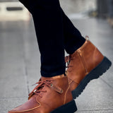 Men's tan lace-up casual boots with ankle tab and dark rubber sole