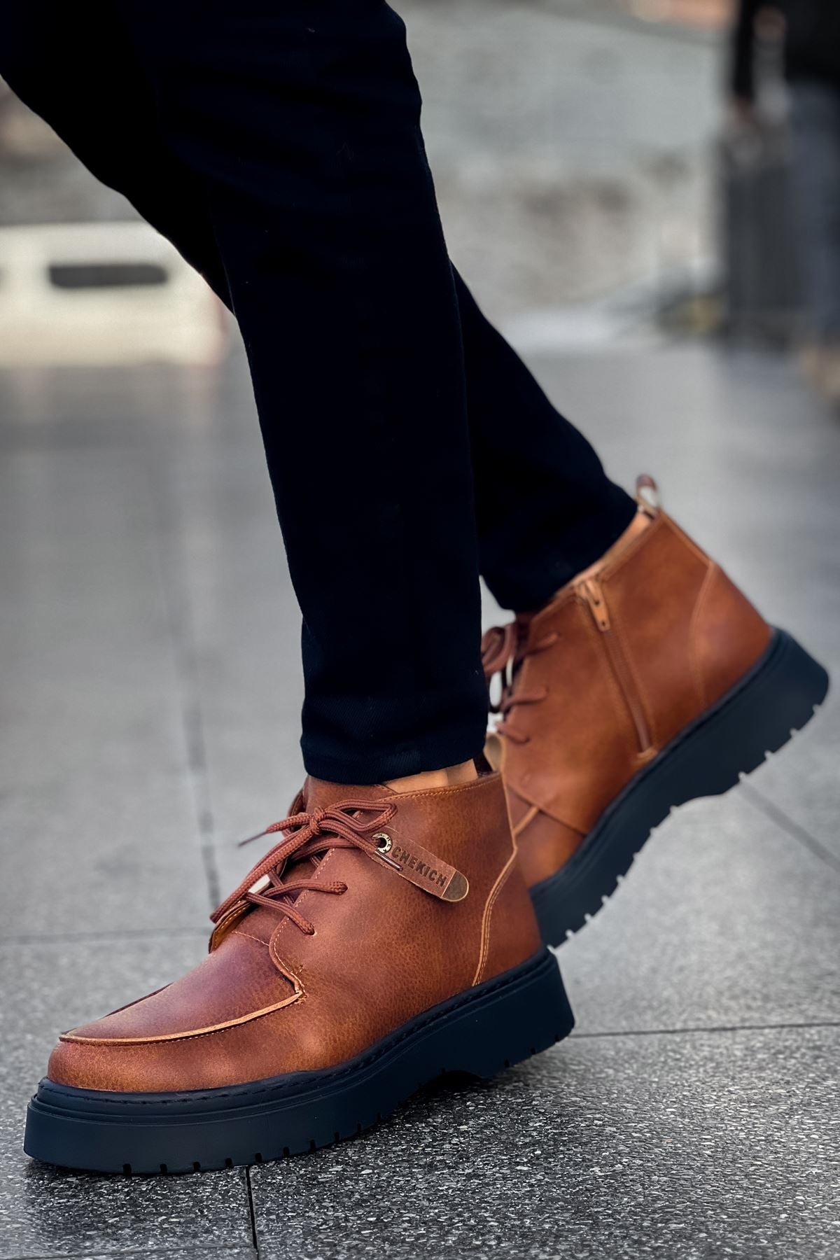 Men's tan lace-up casual boots with ankle tab and dark rubber sole