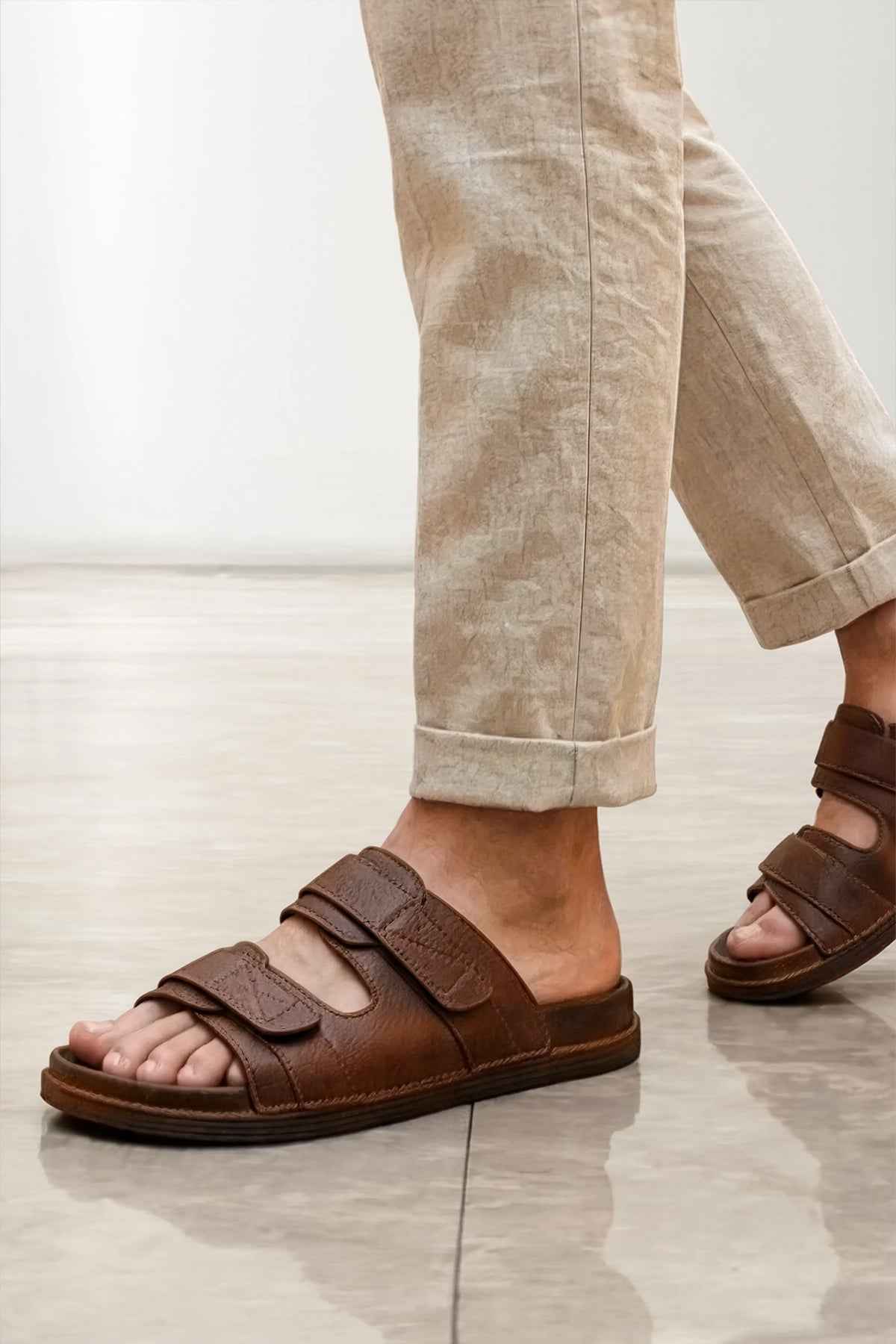 Tan slide sandals for men with two adjustable straps and textured sole