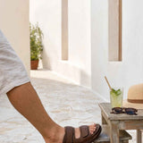 Tan slide sandals with single wide strap and cushioned footbed