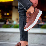 Men's tan lace-up sneakers, side view, white rubber sole