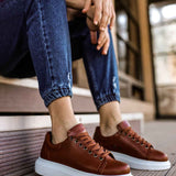 Apollo men's tan lace-up sneakers with white rubber sole and brown stitching detail