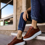 Men's tan lace-up sneakers, white sole and perforated eyelets