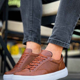 Lix tan low-top sneakers with brown laces, perforated toe and white sole