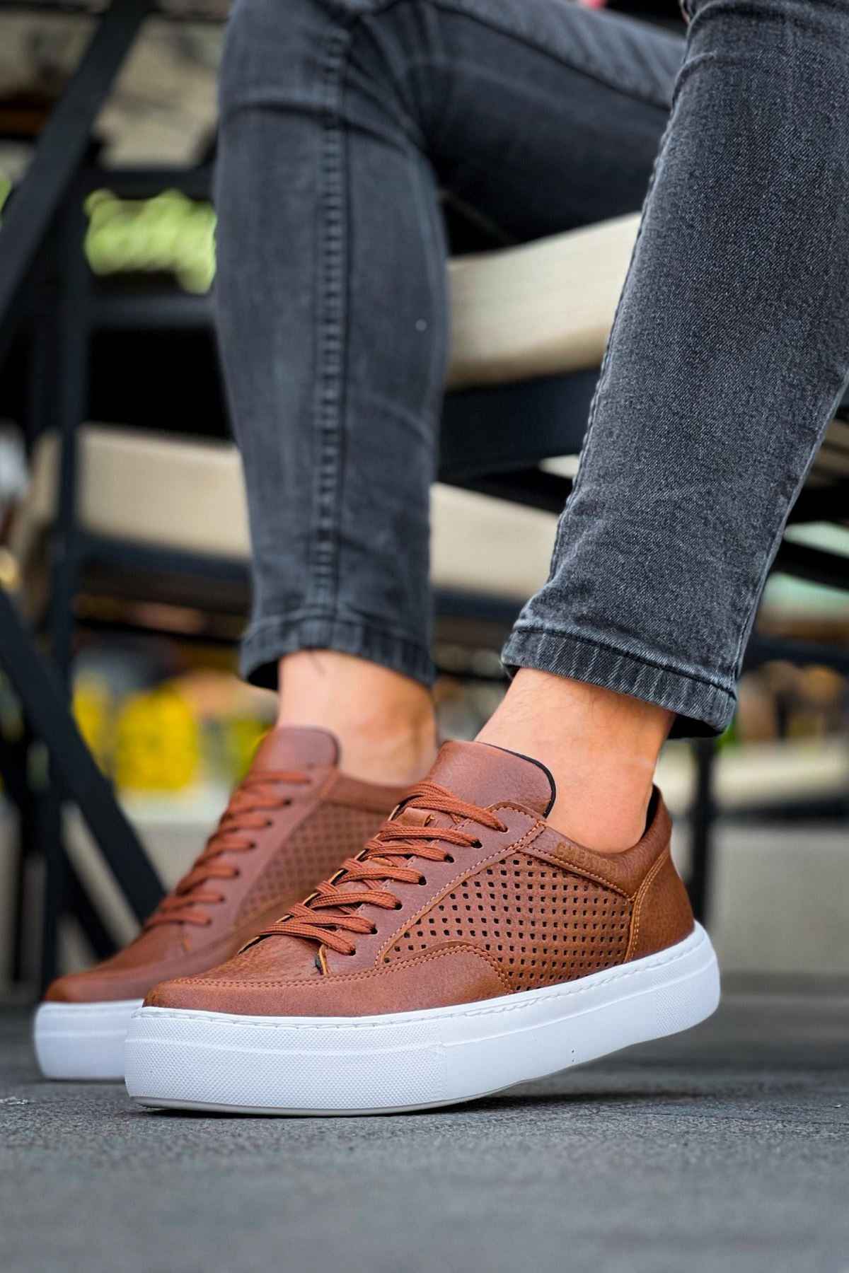 Lix tan low-top sneakers with brown laces, perforated toe and white sole