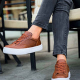 Lix tan sneakers, side view with lace-up eyelets and white sole