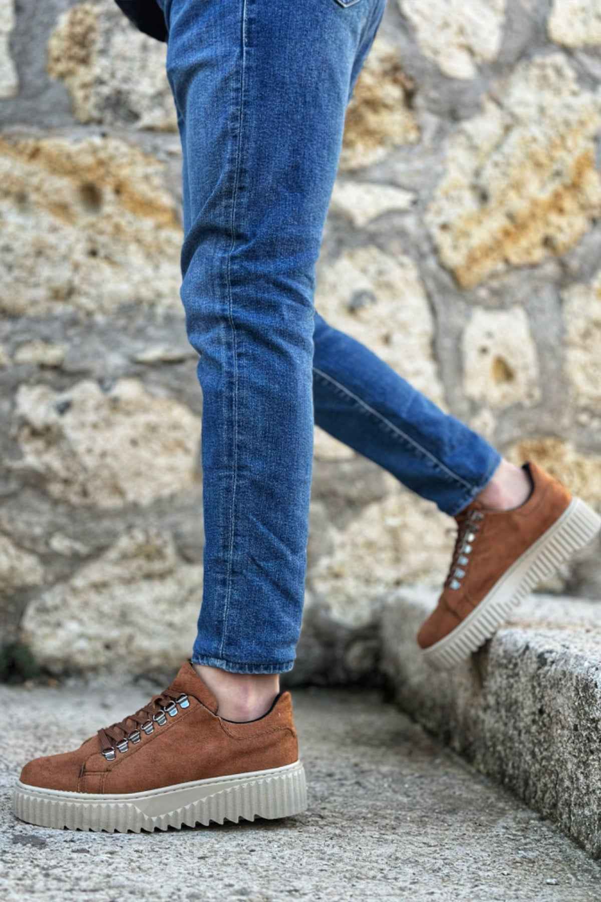 Men's tan suede sneakers with lace-up detail and textured rubber sole