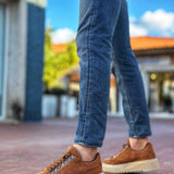 Men's tan suede lace-up sneakers with chunky off-white rubber sole