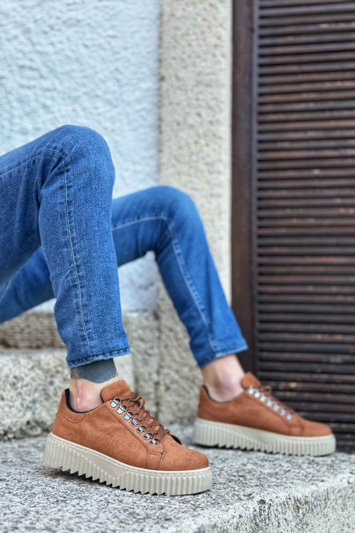 Men's tan suede sneakers with lace-up stitching and low-profile rubber sole