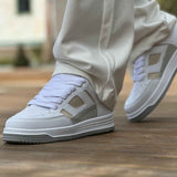 White and beige lace-up low-top sneakers, side view with gray rubber sole