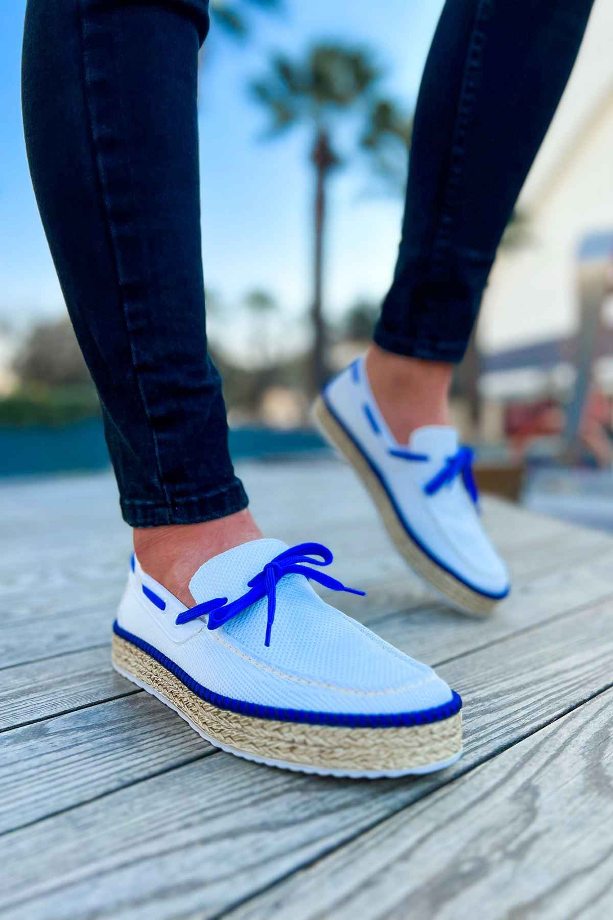 Men's white canvas espadrilles with blue laces and textured jute rope sole