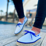 Men's white canvas espadrilles with blue lace-up closure and jute rope outsole