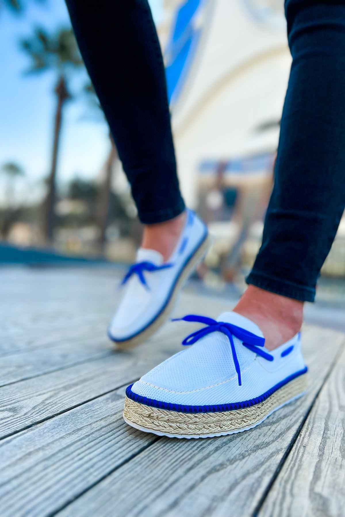 Men's white canvas espadrilles with blue lace-up closure and jute rope outsole