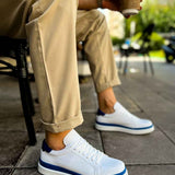 Men's white sneakers with blue trim, low-profile rubber sole