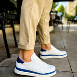 Men's white low-top sneakers with blue side stripes and white laces