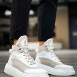 Men's white high-top lace-up boots with gray toe and thick ribbed sole