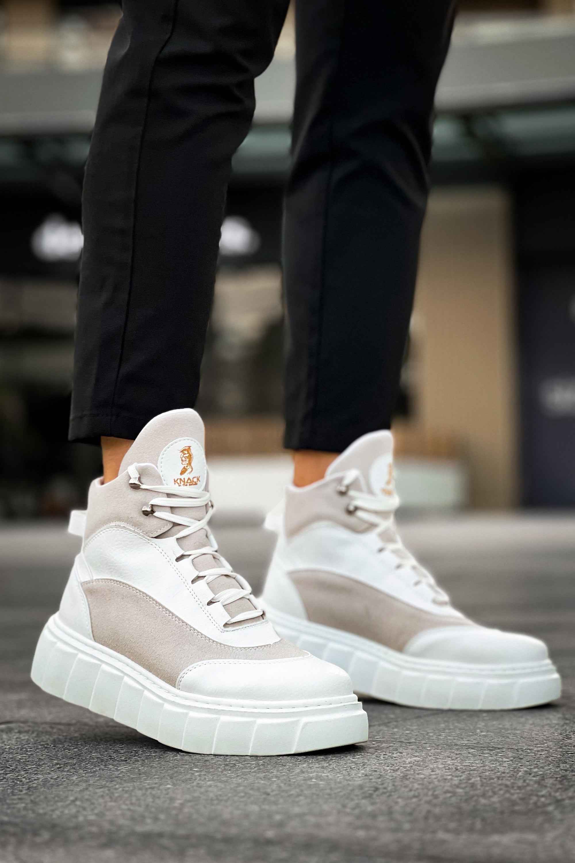 Men's white high-top lace-up boots with gray toe and thick ribbed sole