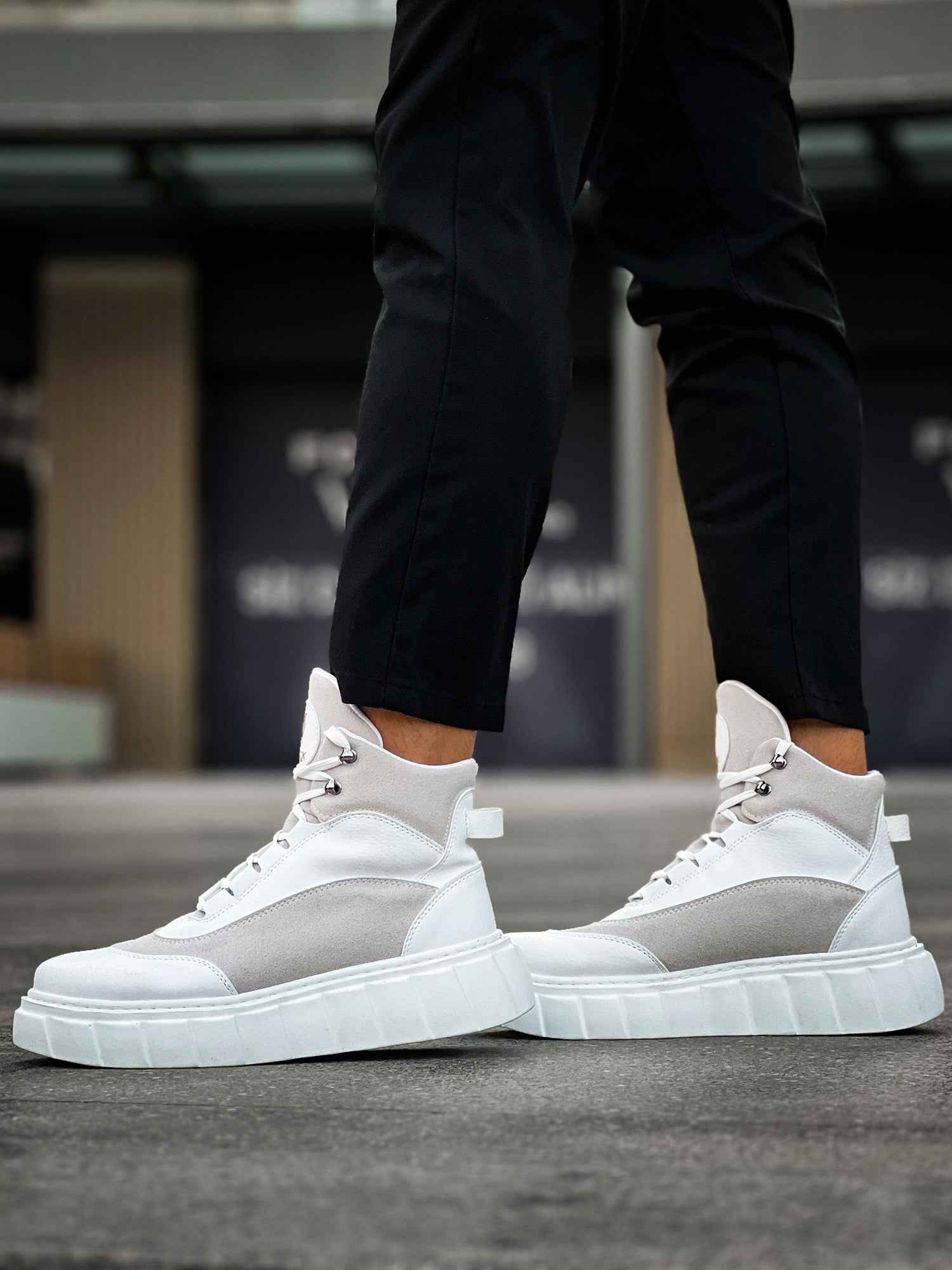 Men's white high-top lace-up boots with gray paneling and oversized sole