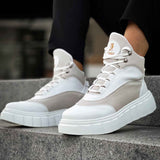 Men's white boots with gray panels, lace-up style, and cushioned platform sole