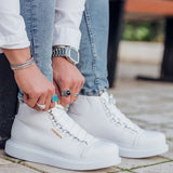 White lace-up boots with stitched panels and a rubber sole
