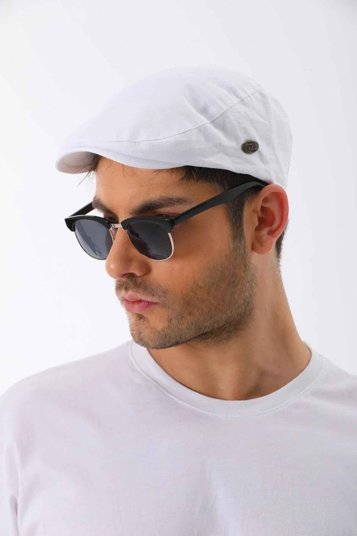 White flat cap with small side button detail