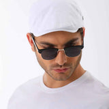 White flat cap with curved brim and small side button