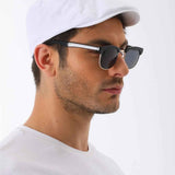 White flat cap with curved brim and small side button