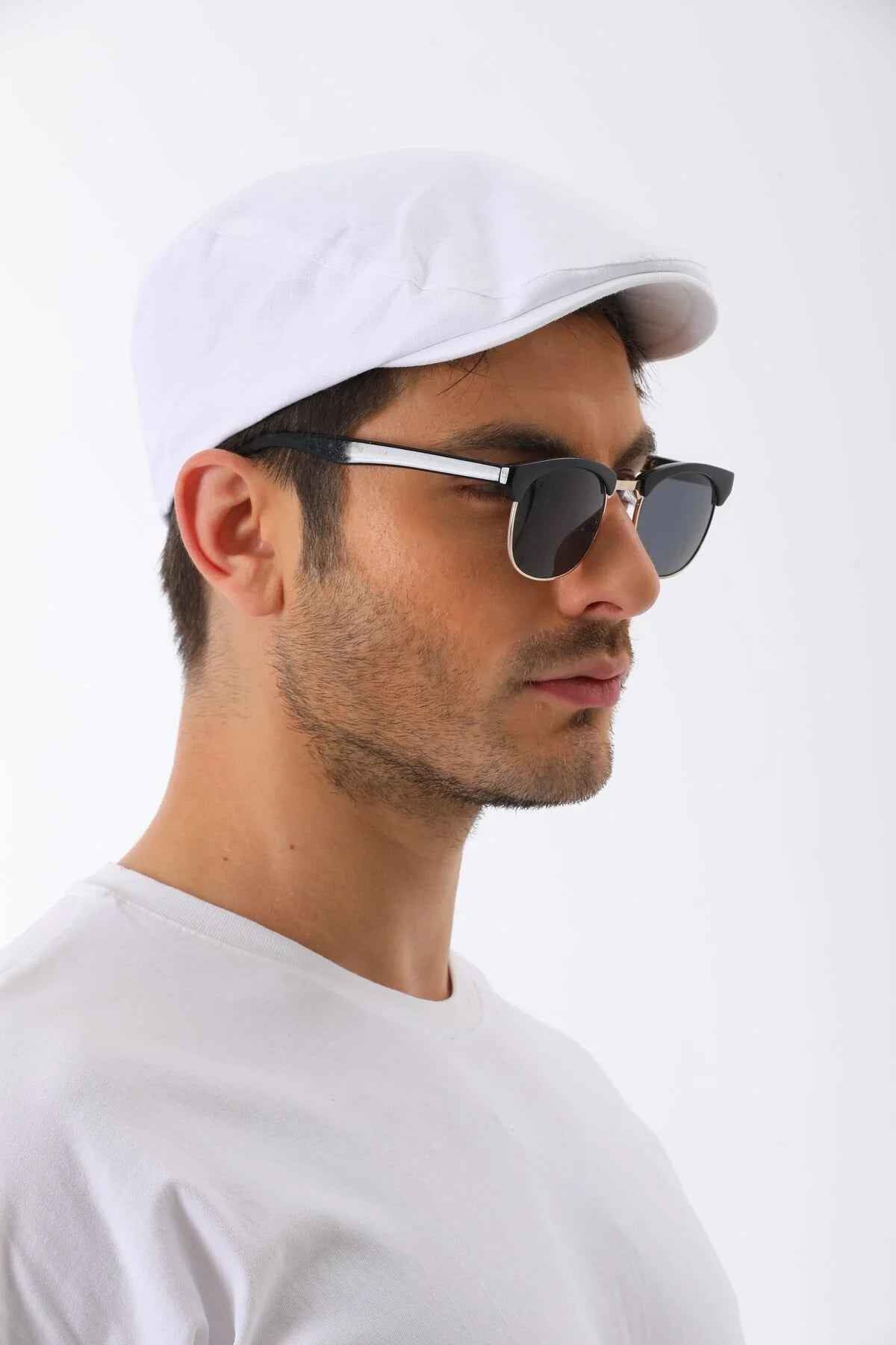 White flat cap with curved brim and small side button