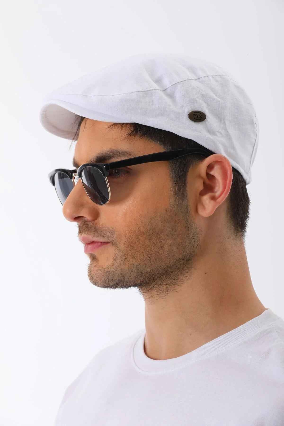 White flat cap side view with small dark button