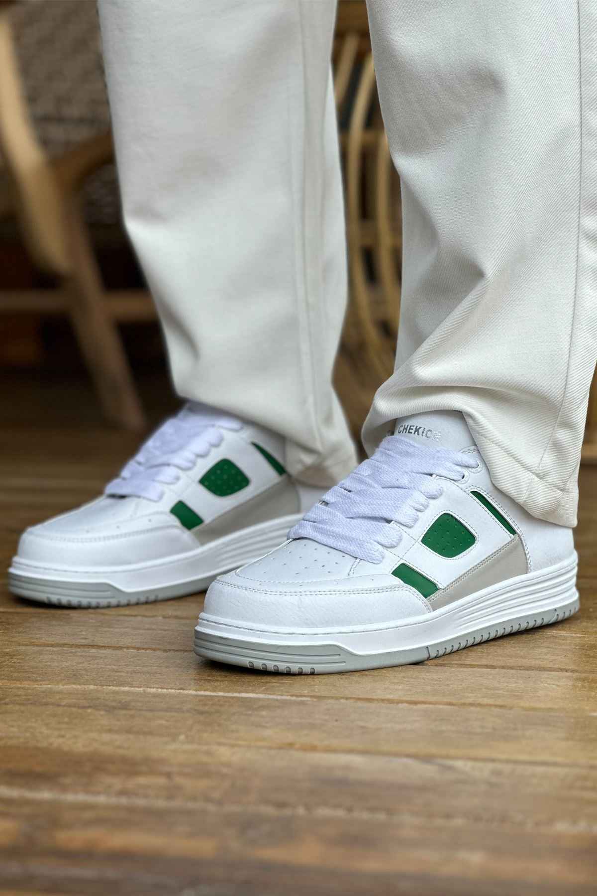 Men's white green low-top sneakers, side view with green accents and white laces