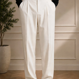Men's white dress pants with black belt and full-length front creases