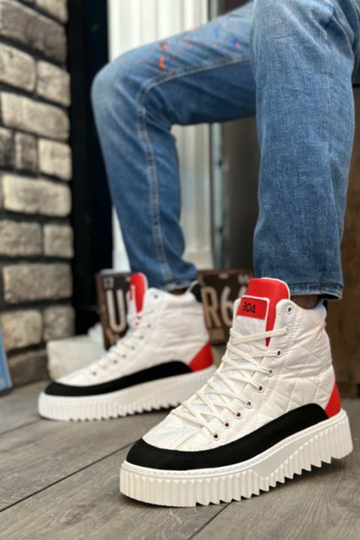 Men's white high-top lace-up boots with red accents, black side stripe, chunky sole