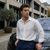 Men's white button-up shirt with pointed collar and long sleeves, front buttons