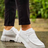 Men's white leather-style lace-up shoes with thick rubber sole, side view