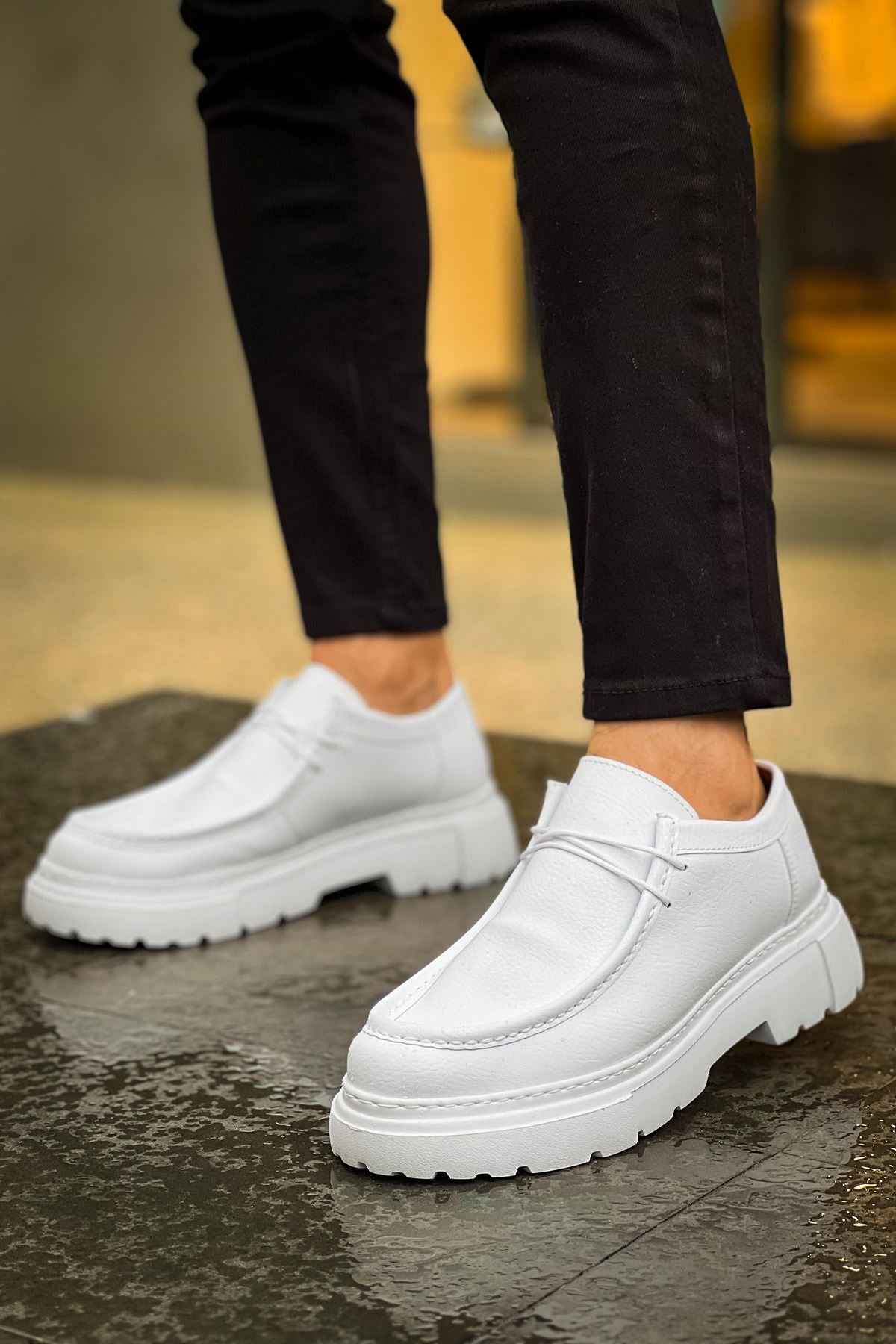 Men's white leather-style lace-up shoes with chunky tread sole, side angle